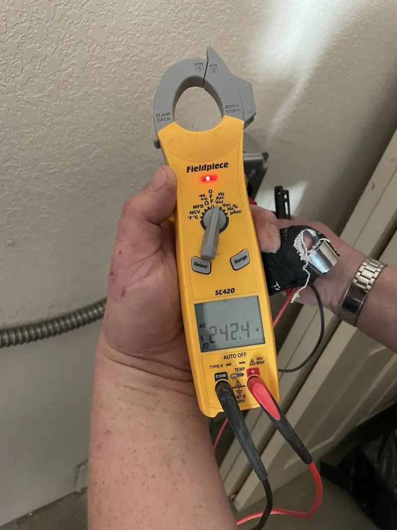 Voltage testing with clamp meter during Ceiling Fan Installation in Newark